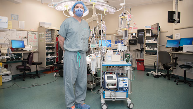 Dr. Anton Skaro with the pump that helps circulate blood to organs that are to be donated.