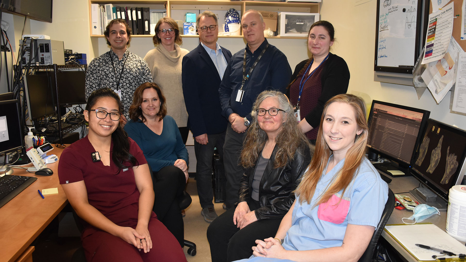 Members of the research team gather in an imaging suite.