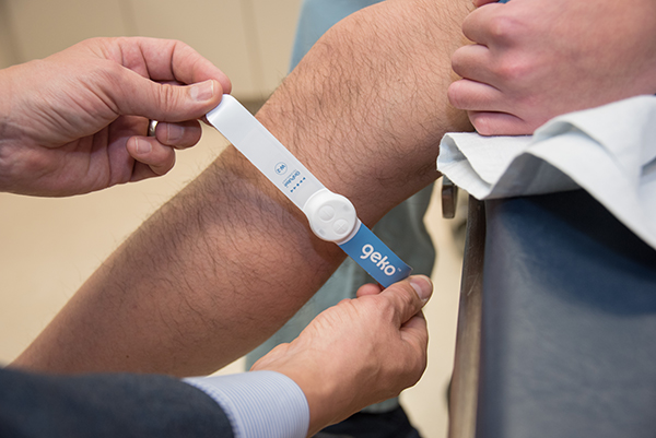 The geko device being applied to the leg