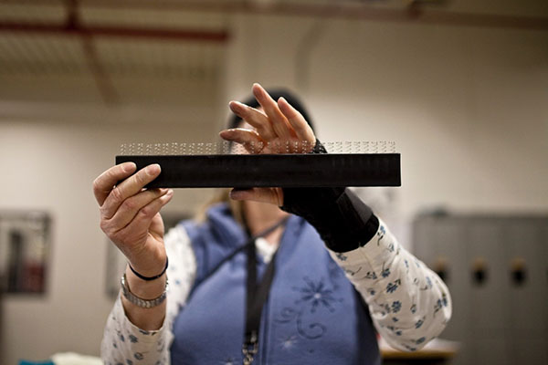 Close up of hands constructing an item 