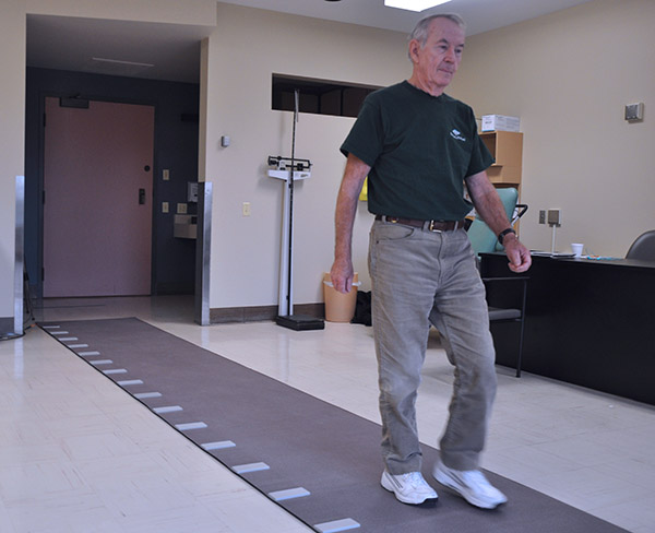 Study participant walking on the gait mat