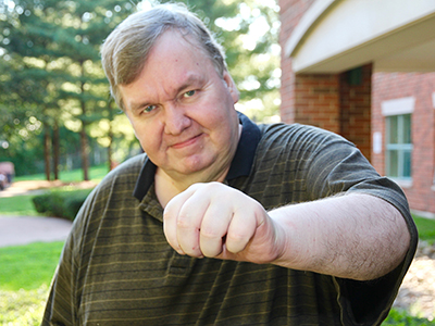 John Humphrey demonstrates the movement he regained in his hand.